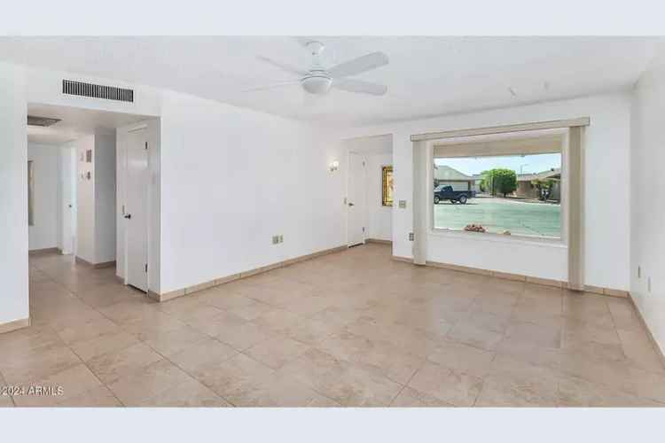 Buy House in Sun City West with Spacious Lot and Modern Features