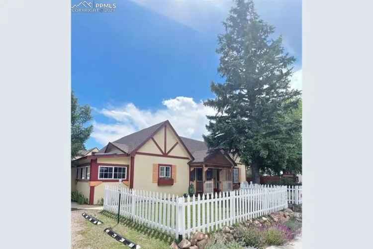 Buy Ranch Style Home Near Main Street Monument with Playhouse and Cottage