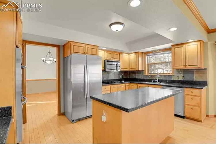 Buy Mountain Home in Meadow Park with Pikes Peak Views and Modern Features