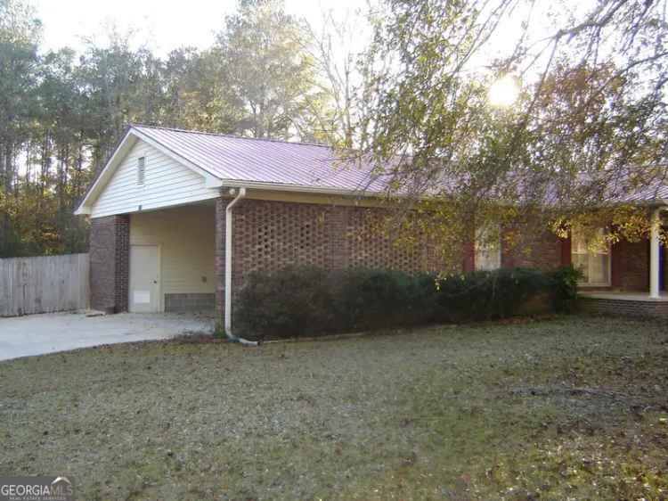 Rent 4 Bedroom Brick Home with Enclosed Carport in an Inviting Location