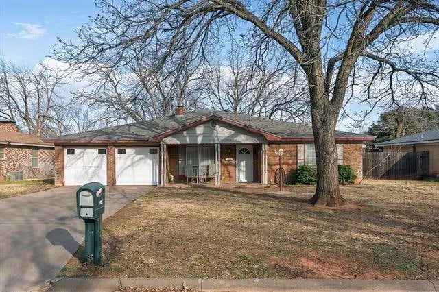 Spacious buy home in Abilene with large backyard and storage sheds