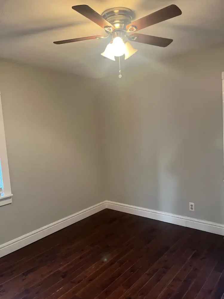 Rent Home in Garden City Park with New Appliances and Backyard Access