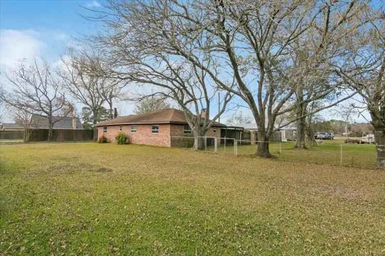 Buy House in Anahuac with Brick Charm and Spacious Backyard