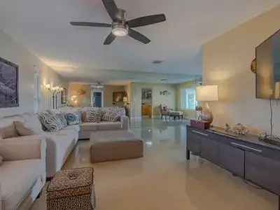 Rent Riverfront Home with Modern Features Near Beach