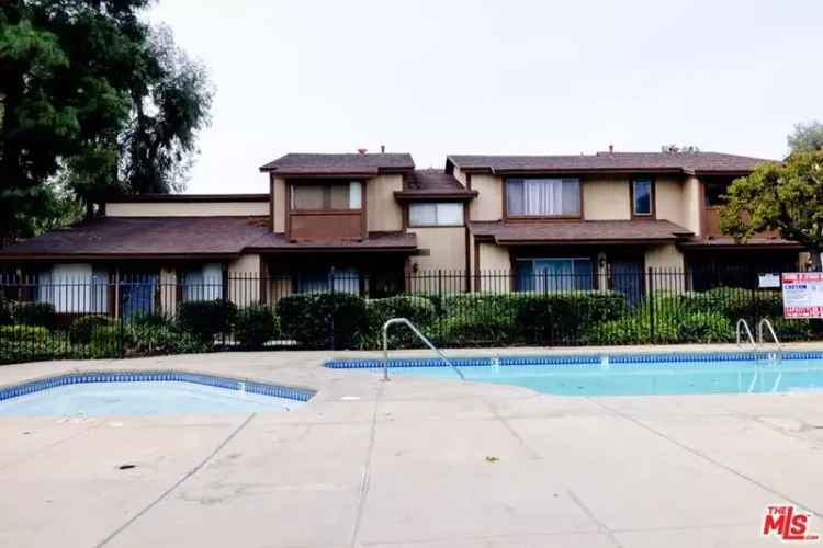 Buy Townhome with Pool Views in Walkable Neighborhood