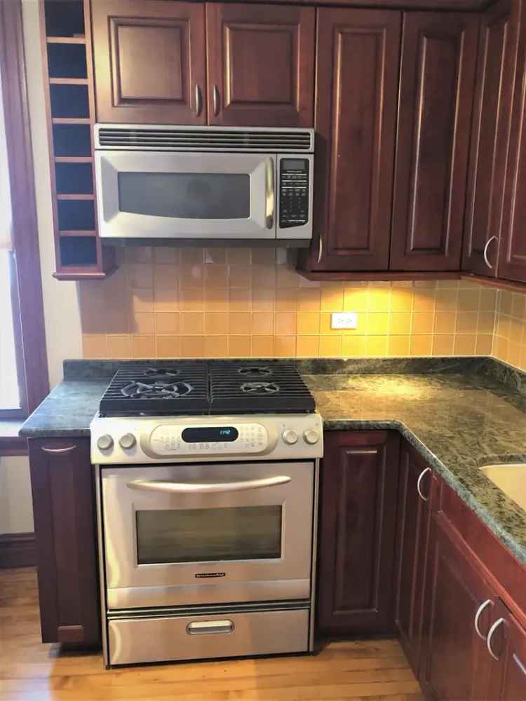 Rent Updated Spacious Apartment in Ukrainian Village with Balcony and Parking