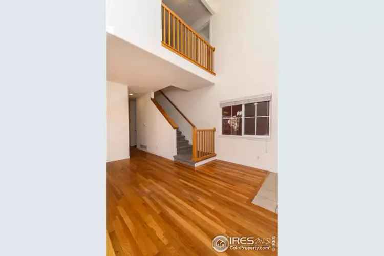 Buy Townhome in South Facing Location with New Carpet and Vaulted Ceilings