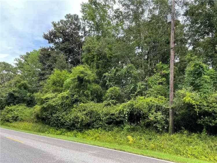 Buy Wooded Lot in Prime Location with Frontage on Club House and Van Liew Roads