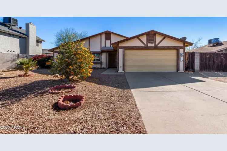 Buy house in Desert Cove Manor featuring a cozy fireplace and RV gate