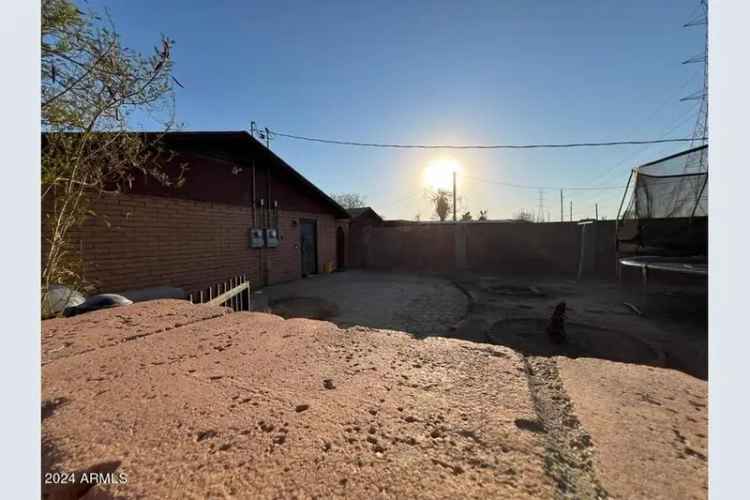 Buy duplex in Phoenix with outdoor space and rental income potential