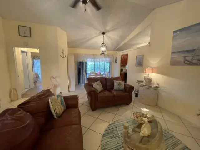 Rent Updated Townhouse in PGA National Gated Community with Garden Features