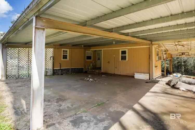 Fixer Upper Buy Opportunity on 4 Acres with Workshop and Carports