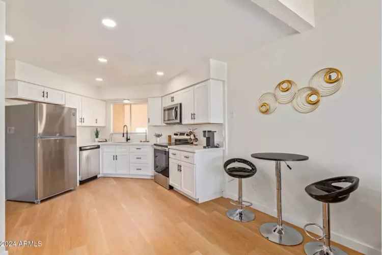 Buy Townhome in Vibrant Community with Remodeled Features and Garage