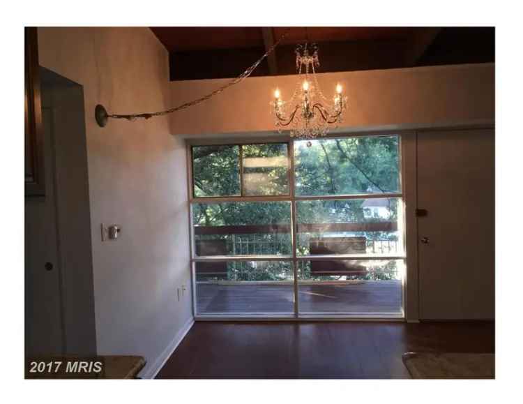 Rent Beautiful Upper Level Condo in Convenient Location with Balcony and Fireplace