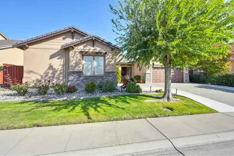 Buy single story house in Woodcreek Village with serene backyard