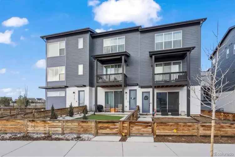 Contemporary townhome for sale with balcony and garage