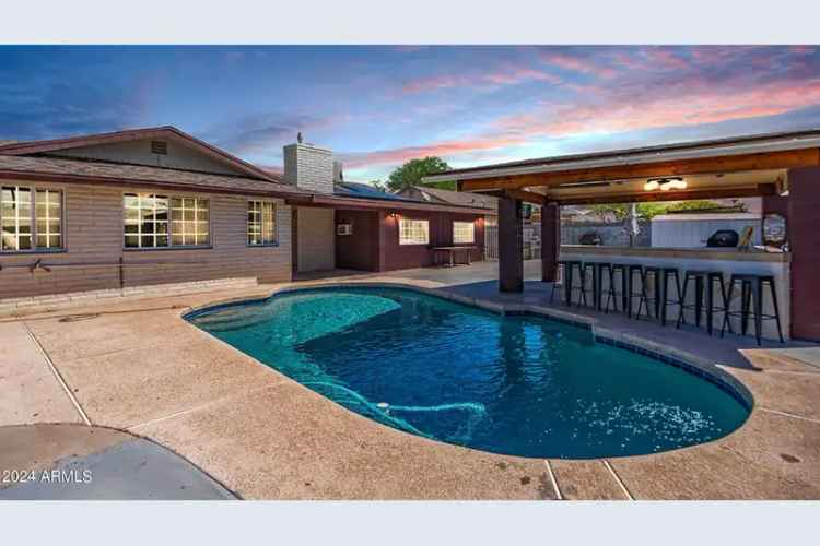 Buy updated home with pool in a resort style backyard featuring modern upgrades