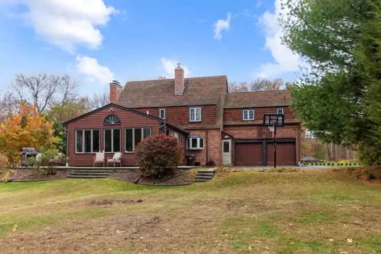 Buy Tudor Home with Heated Pool Near University Campus