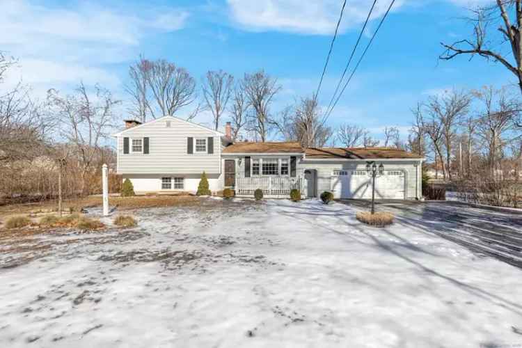 split-level buy in Wallingford with modern updates and large yard