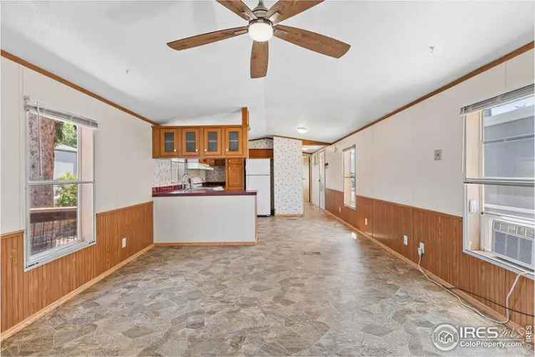 Buy updated home in Longmont with 2 beds, 1.5 baths, and pet friendly features