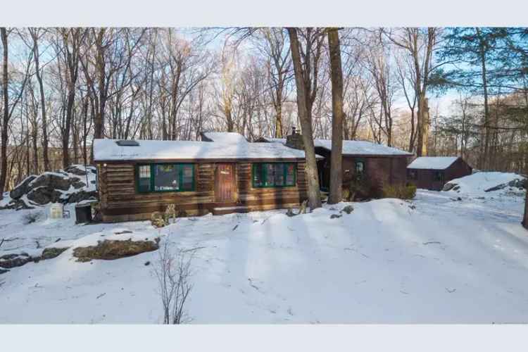 Rent a charming log cabin in Ridgefield with lake rights and custom features