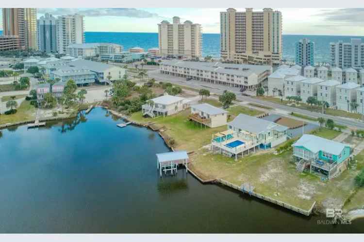 Luxury buy waterfront home in Gulf Shores with pool and dock features