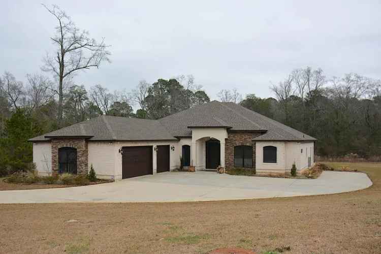 Buy all brick home in serene location featuring grand room and three car garage