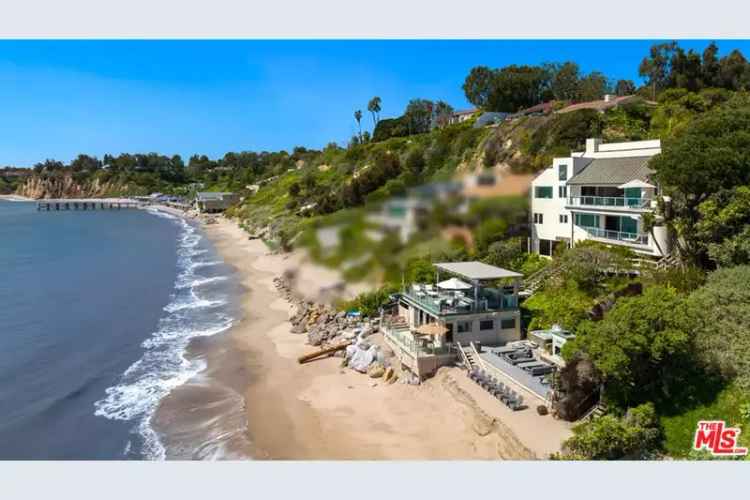 Buy Contemporary Residence in Paradise Cove with Beach Frontage and Guest House