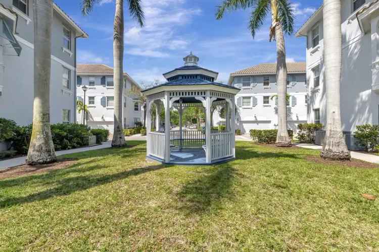 Buy townhouse in Boynton Beach featuring 3 bedrooms and serene garden views