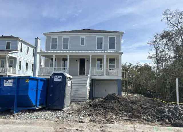 Custom built home for sale in West Ashley with marshfront views and dock access